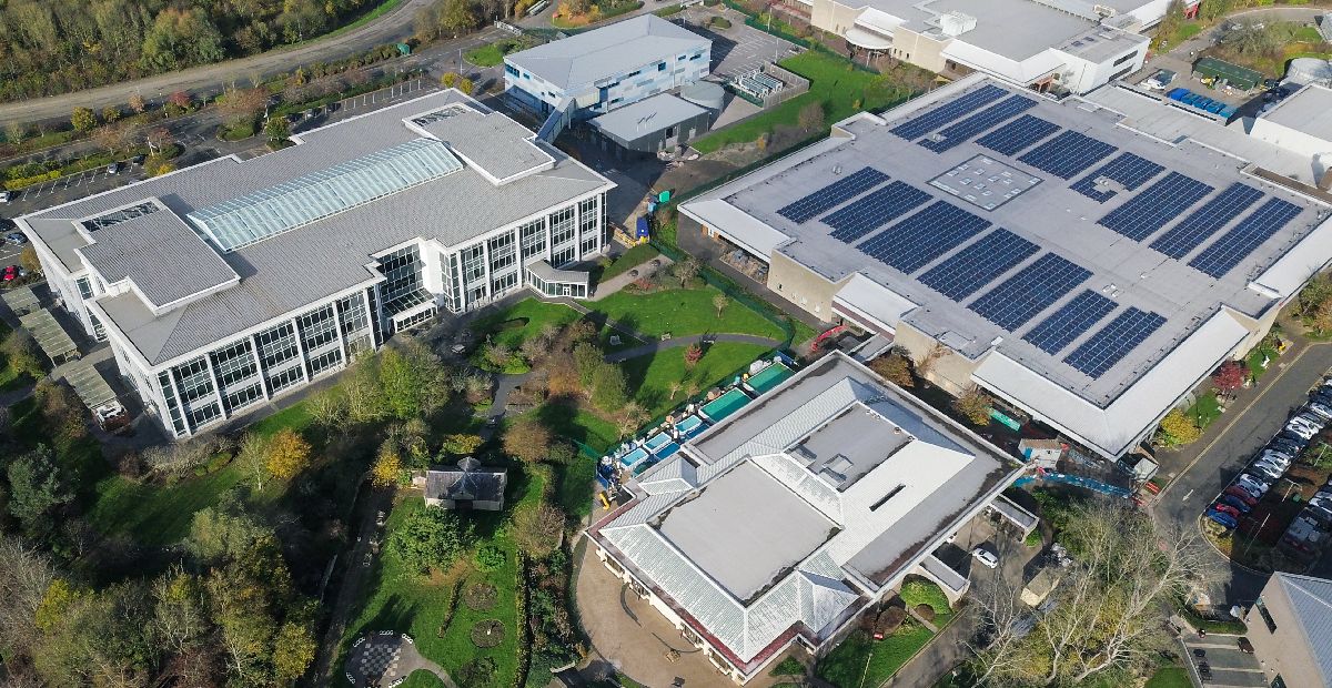 A bank of industrial-scale LFP batteries integrated with a solar inverter system