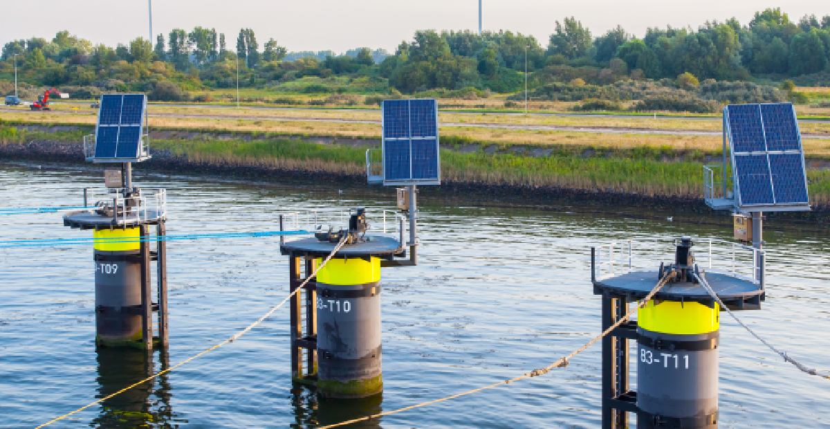 A solar powered pump delivering water to an agricultural field in rural India