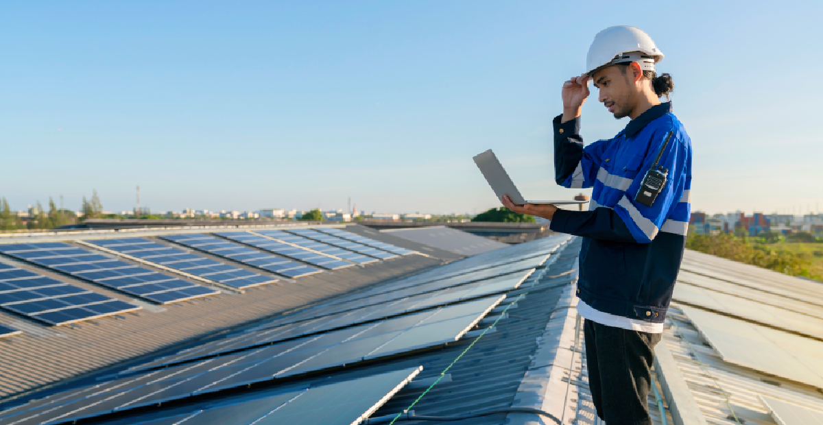 Close-up of a high-efficiency commercial rooftop solar installation on a textile mill